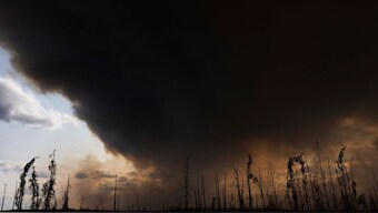 Wildfire smoke hangs in the air above Highway 97 north of Buckinghorse River, British Columbia, on Friday, May 30, 2025. AP Photo