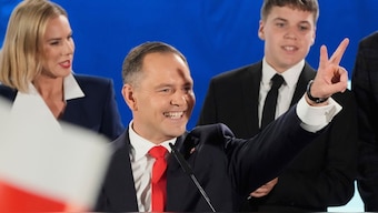 Presidential candidate Karol Nawrocki, a conservative historian backed by the right-wing Law and Justice party greets supporters as he arrives at his headquarters after the presidential election runoff in Warsaw, Poland, Sunday, June 1, 2025. (AP)
