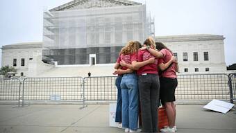 A group of women pray outside the US Supreme Court, on the final day of the Court's term, in Washington, DC, on June 27, 2025.  Image- AFP