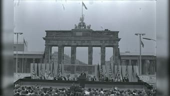 US President Ronald Reagan speaks to the crowd gathered at the Brandenburg Gate after his arrival in West Berlin to help celebrate the city's 750th anniversary, June 12, 1987. File Image/Reuters