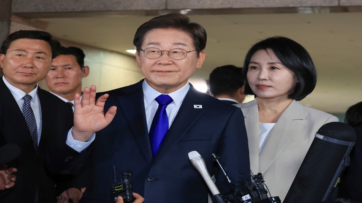 South Korea's Democratic Party's presidential candidate Lee Jae-myung, center, and his wife Kim Hea Kyung, right, greet supporters and residents as they leave from a home in Incheon, South Korea, on Tuesday. AP South Korea's Democratic Party's presidential candidate Lee Jae-myung, center, and his wife Kim Hea Kyung, right, greet supporters and residents as they leave from a home in Incheon, South Korea, on Tuesday. AP