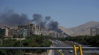 Smoke rises from an oil storage facility after it appeared to have been struck by an Israeli strike on Saturday, in Tehran, Iran, on Monday. AP 