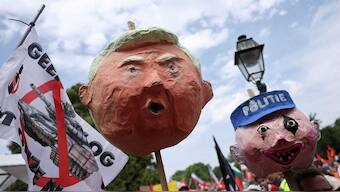 Demonstrators hold a papier-mache head depicting US President Donald Trump, as they gather to march against the upcoming Nato leaders' summit, at The Hague, Netherlands, June 22, 2025. File Image/Reuters