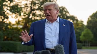 President Donald Trump speaks with reporters before boarding Marine One on the South Lawn of the White House, on Tuesday. AP