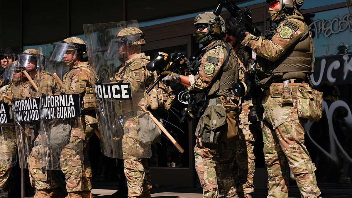 California National Guard troops stand guard as people attend a rally against federal immigration sweeps, in Los Angeles, California, US on June 9, 2025. Reuters California National Guard troops stand guard as people attend a rally against federal immigration sweeps, in Los Angeles, California, US on June 9, 2025. Reuters