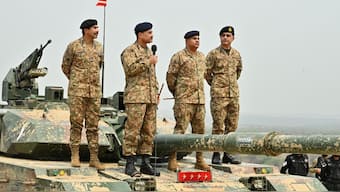 Chief of Army Staff of Pakistan Asim Munir holds a microphone during his visit at the Tilla Field Firing Ranges (TFFR) to witness the Exercise Hammer Strike, a high-intensity field training exercise conducted by the Pakistan Army's Mangla Strike Corps, in Mangla, Pakistan May 1, 2025. Inter-Services Public Relations (ISPR) via Reuters
