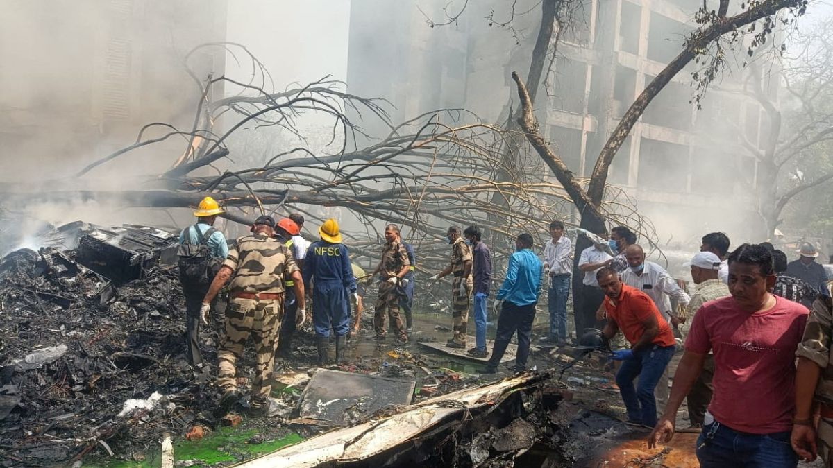Emergency personnel and other people gather near damaged property, at the site where an Air India plane crashed, in Ahmedabad, June 12, 2025. Reuters Emergency personnel and other people gather near damaged property, at the site where an Air India plane crashed, in Ahmedabad, June 12, 2025. Reuters