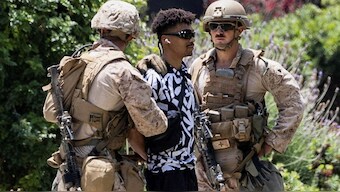 US marines detain a person outside the Wilshire Federal Building in Los Angeles. Reuters