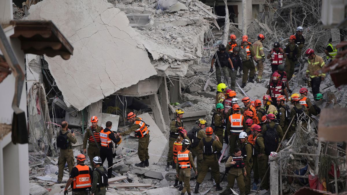 Israeli security forces inspect destroyed houses that were struck by a missile fired from Iran, in Rishon Lezion, Israel on Saturday, June 14, 2025. AP Israeli security forces inspect destroyed houses that were struck by a missile fired from Iran, in Rishon Lezion, Israel on Saturday, June 14, 2025. AP