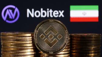 Representations of cryptocurrency Binance are seen in front of displayed Nobitex logo and Iran flag in this illustration taken November 3, 2022. REUTERS