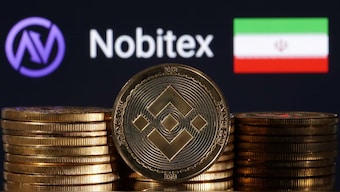 Representations of cryptocurrency Binance are seen in front of displayed Nobitex logo and Iran flag in this illustration taken November 3, 2022. REUTERS