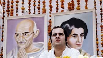 (File) A picture of Sanjay Gandhi taken during a meeting in Avril 1976 in front of portrait of Mahatma Gandhi and of his mother Indira Gandhi.  AFP