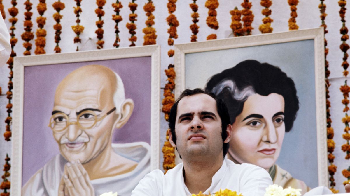 (File) A picture of Sanjay Gandhi taken during a meeting in Avril 1976 in front of portrait of Mahatma Gandhi and of his mother Indira Gandhi. AFP (File) A picture of Sanjay Gandhi taken during a meeting in Avril 1976 in front of portrait of Mahatma Gandhi and of his mother Indira Gandhi. AFP