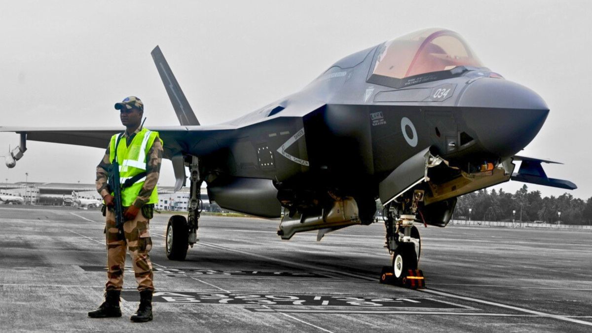 A CISF personnel stand guard near the British F-35 fighter jet that made an emergency landing after running low on fuel at the Thiruvananthapuram International Airport on June 14 night. @CISFHQrs via PTI Photo A CISF personnel stand guard near the British F-35 fighter jet that made an emergency landing after running low on fuel at the Thiruvananthapuram International Airport on June 14 night. @CISFHQrs via PTI Photo