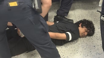 The viral video shows an Indian student being handcuffed and pinned down by officials at a US airport. Image: X

