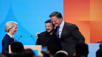 European Commission President Ursula von der Leyen, left, and Nato Secretary General Mark Rutte, right, greet Ukraine's President Volodymyr Zelenskyy as he arrives for the Nato defence forum on the sidelines of the Nato summit in The Hague, Netherlands, on Tuesday. Reuters