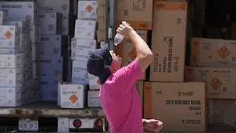 Wyatt Seymore pours the last drops of liquid from a water bottle into his mouth. File image/AP