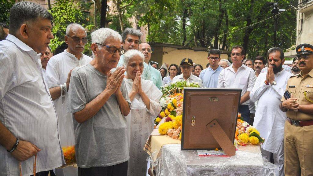 Pushkaraj Sabharwal, father of Captain Sumeet Sabharwal who was the pilot of the Air India plane which crashed in Ahmedabad, pays tribute after his son's mortal remains were brought to Mumbai for his last rites. Pushkaraj has called the preliminary report 