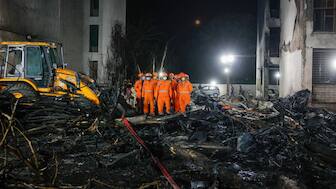 Rescue personnel stand next to the wreckage of an Air India aircraft, bound for London's Gatwick Airport, which crashed during take-off from an airport in Ahmedabad, on June 12. Reuters
