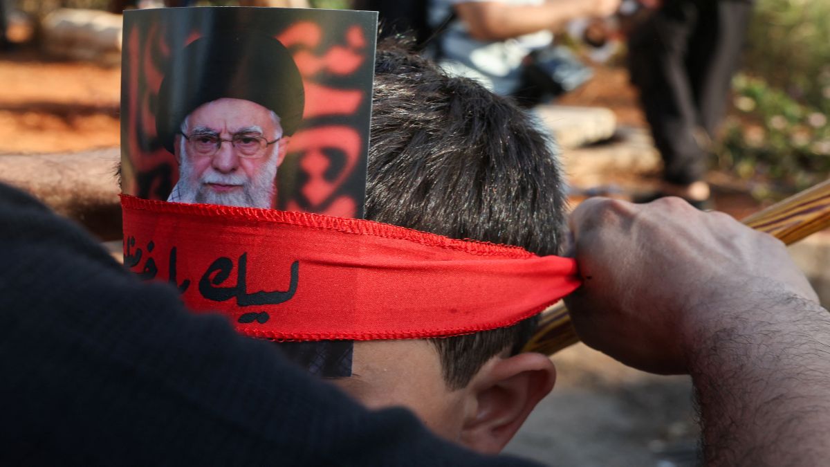 A person carries a picture of Iran's Supreme Leader Ayatollah Ali Khamenei on his forearm in Beirut, Lebanon. Reuters A person carries a picture of Iran's Supreme Leader Ayatollah Ali Khamenei on his forearm in Beirut, Lebanon. Reuters