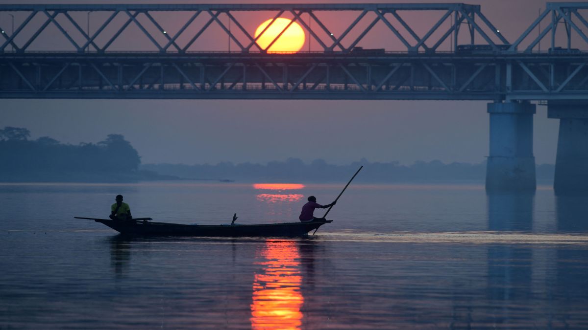 (File) Fishermen steer a boat on the Brahmaputra River at sunset in Guwahati. In his rebuttal to Pakistan's threat, Himanta Biswa Sarma said that China contributes only about 30 to 35 per cent of the Brahmaputra's total flow. Reuters (File) Fishermen steer a boat on the Brahmaputra River at sunset in Guwahati. In his rebuttal to Pakistan's threat, Himanta Biswa Sarma said that China contributes only about 30 to 35 per cent of the Brahmaputra's total flow. Reuters