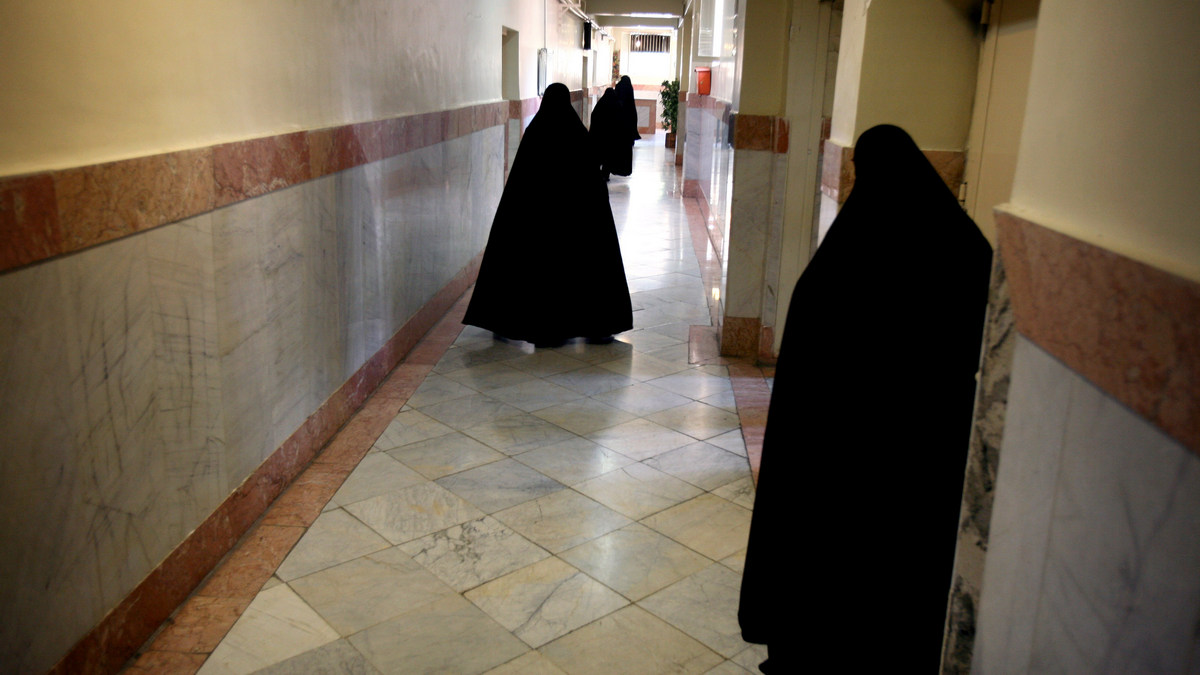 Female prison guards walk along a corridor in Tehran's Evin prison June 13, 2006. Reuters Female prison guards walk along a corridor in Tehran's Evin prison June 13, 2006. Reuters