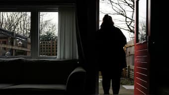 A woman poses at her home in England, Britain, January 8, 2025. She was 14 when she was sexually abused by a grooming gang in Rochdale. Source: Reuters