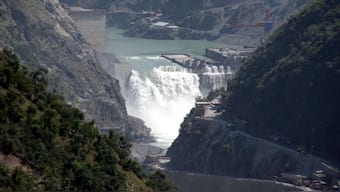 Water flows on the banks of Chenab River with the Baglihar hydroelectric project in the background, about 155 km  northwest of Jammu. India is conducting a feasibility study to construct a 113 km-long canal to redirect surplus flow from the three western rivers of the Indus water system to Punjab, Haryana and Rajasthan. File photo/Reuters