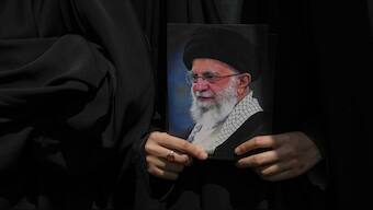 A protester holds a poster of the Iranian Supreme Leader Ayatollah Ali Khamenei during a protest to condemn Israeli attacks on multiple cities across Iran. On Sunday, the US joined Israel's strikes on Tehran, attacking three of   the country's nuclear facilities. File  image/AP