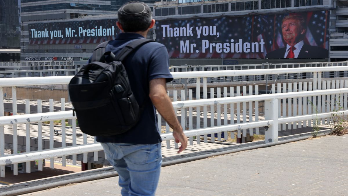 A man walks on a bridge in front of banners bearing a pictures of US President Donald Trump accompanied by a messages, in Tel Aviv. On Monday night, Trump announced that Iran and Israel had agreed to a ceasefire, ending the 12-day war. AFP A man walks on a bridge in front of banners bearing a pictures of US President Donald Trump accompanied by a messages, in Tel Aviv. On Monday night, Trump announced that Iran and Israel had agreed to a ceasefire, ending the 12-day war. AFP