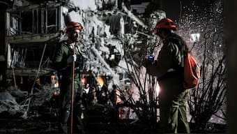 Rescue and security personnel work at an impact site following missile attack from Iran on Israel, in  Ramat Gan, Israel  June 13. Israel says Iran has fired up to 100 missiles in retaliation to Operation Rising Lion. Reuters 