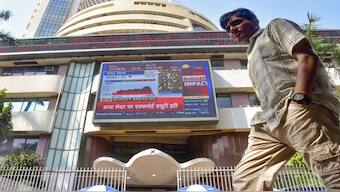 A man passes by the Bombay Stock Exchange (BSE) building on the day of Union Budget 2025-26 presentation, in Mumbai. File image/PTI