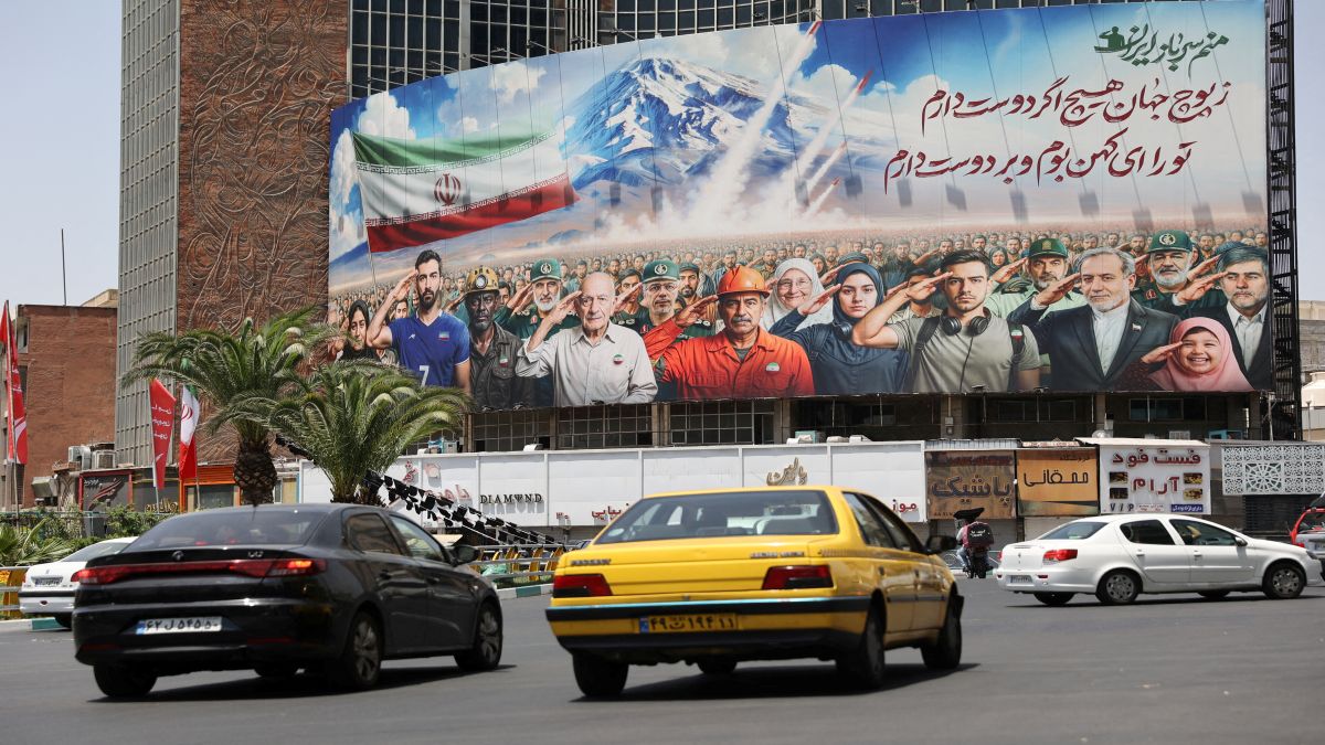A billboard with an illustration of Iranians supporting their country is seen on a street, amid the Israel-Iran conflict, in Tehran, Iran. Reuters A billboard with an illustration of Iranians supporting their country is seen on a street, amid the Israel-Iran conflict, in Tehran, Iran. Reuters
