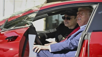 US President Donald Trump and Tesla CEO Elon Musk speak to reporters as they sit in a red Model S Tesla vehicle on the South Lawn of the White House. File image/AP