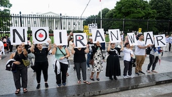 Americans protest the Israeli strikes on Iran and any potential US involvement in the conflict during a "No War on Iran" demonstration outside the White House in Washington, DC. US President Donald Trump said on June 18 that he was still deciding whether to join Israel's strikes on Iran, claiming Tehran now wants talks at the White House but may have waited too long. AFP