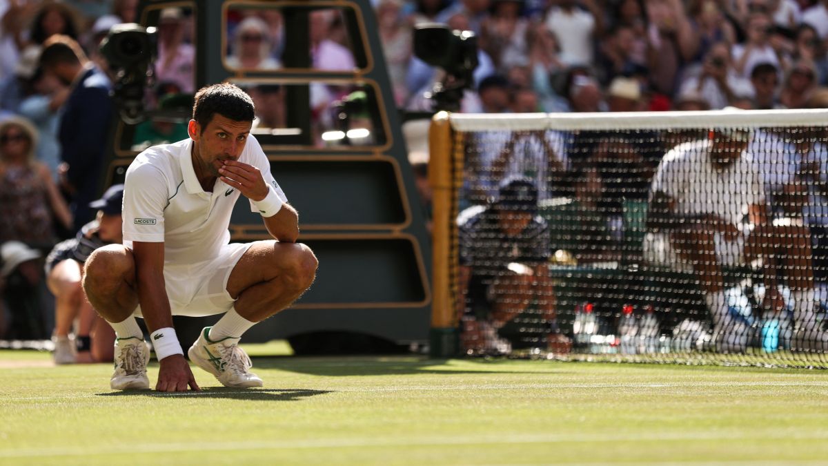 Novak Djokovic eats a blade of grass from Centre Court court after defeating Nick Kyrgios during their men's singles final tennis match at the 2022 Wimbledon Championships at The All England Tennis Club in Wimbledon. File image/AFP Novak Djokovic eats a blade of grass from Centre Court court after defeating Nick Kyrgios during their men's singles final tennis match at the 2022 Wimbledon Championships at The All England Tennis Club in Wimbledon. File image/AFP
