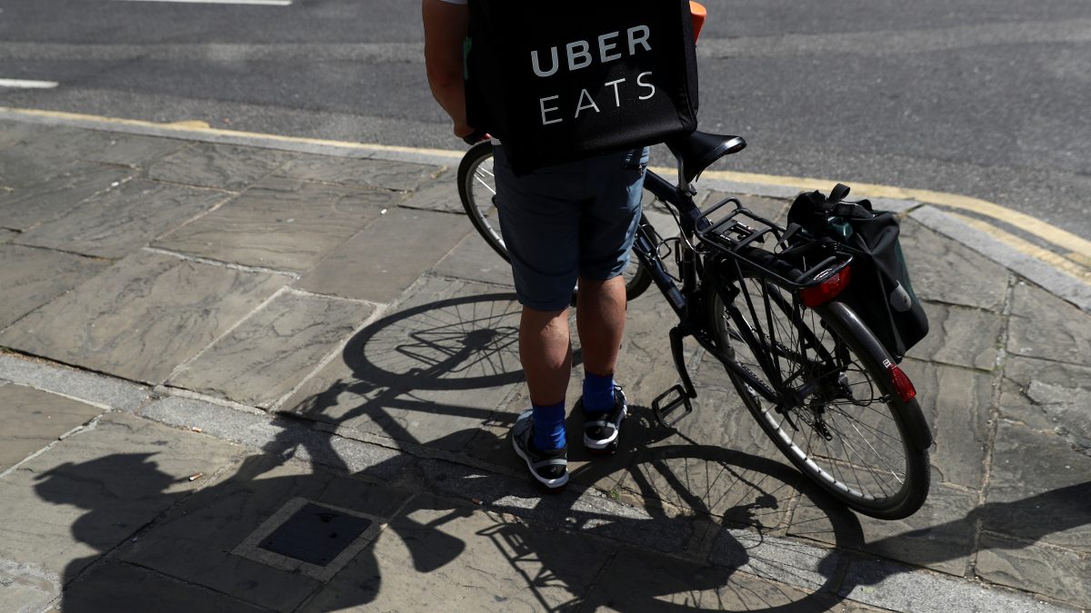 A cyclist prepares to delivery an Uber Eats food order in London, Britain. Reuters A cyclist prepares to delivery an Uber Eats food order in London, Britain. Reuters