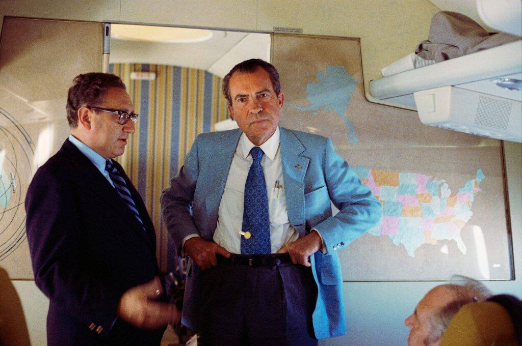 US President Richard Nixon and National Security Adviser Henry Kissinger stand on Air Force One. Reuters
