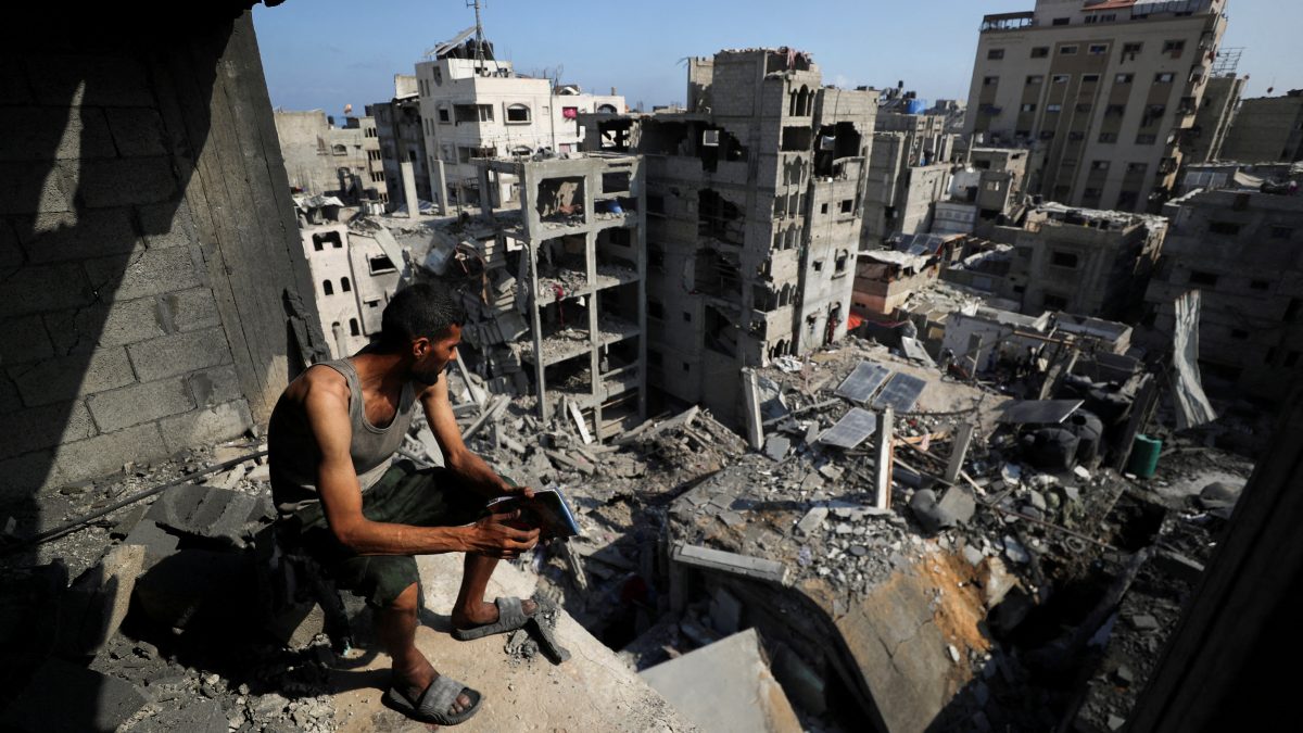 A Palestinian looks on at the site of Thursday's Israeli strike that damaged and destroyed residential buildings, at Shati (Beach) refugee camp, in Gaza City. Reuters A Palestinian looks on at the site of Thursday's Israeli strike that damaged and destroyed residential buildings, at Shati (Beach) refugee camp, in Gaza City. Reuters