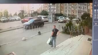 CCTV footage shows the SBU officer walking down the stairs moments before he was shot in Kyiv, Ukraine, on July 10. Ukrainska Pravda/Reuters