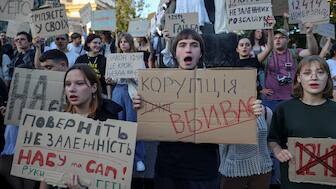 Ukrainians protest in the first wartime rally against a newly passed law, which curbs independence of anti-corruption institutions. Reuters