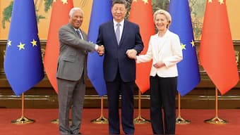 Chinese President Xi Jinping shakes hands with European Council President Antonio Costa and European Commission President Ursula von der Leyen at the Great Hall of the People in Beijing, China. Reuters
