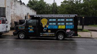 A bus belonging to the Think Outside Da Block gun violence prevention program sits parked outside of the organization’s office, in Chicago, Illinois, US. Reuters