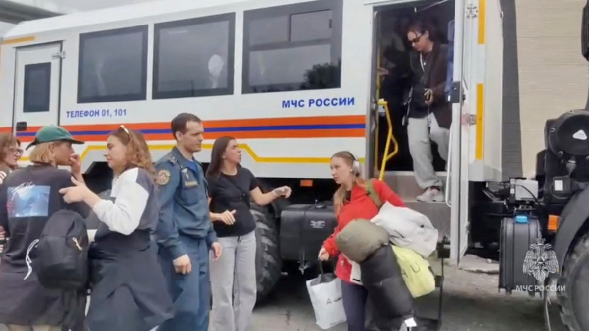 Evacuees walk out of a truck as rescuers relocate them to a safe area due to the tsunami threat following a powerful earthquake, in the region of Kamchatka, Russia. Reuters Evacuees walk out of a truck as rescuers relocate them to a safe area due to the tsunami threat following a powerful earthquake, in the region of Kamchatka, Russia. Reuters