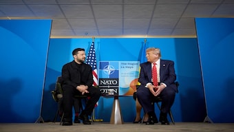 Ukraine's President Volodymyr Zelensky (L) meets with US President Donald Trump on the sideline of the North Atlantic Treaty Organization (NATO) summit in The Hague. File Image / AFP