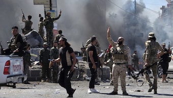Syria's security forces enter the predominantly Druze city of Sweida on July 15, 2025, following clashes between Bedouin tribes and Druze fighters. Syrian government forces entered the majority Druze city of Sweida on July 15, 2025, the interior ministry said, aiming to end clashes with Bedouin tribes that have killed nearly 100 people. (Photo by Sam HARIRI / AFP)