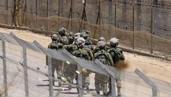 Israeli troops patrol the border fence with Syria near the Druze village of Majdal Shams in the Israel-annexed Golan Heights. AFP
