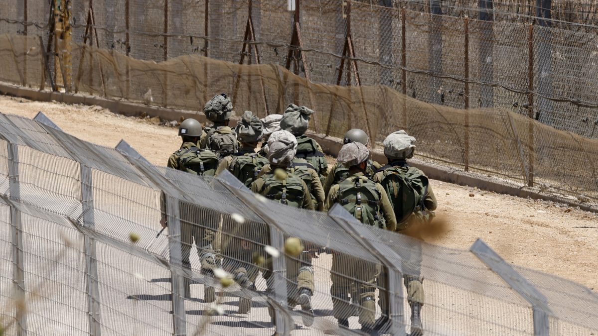 Israeli troops patrol the border fence with Syria near the Druze village of Majdal Shams in the Israel-annexed Golan Heights. AFP Israeli troops patrol the border fence with Syria near the Druze village of Majdal Shams in the Israel-annexed Golan Heights. AFP