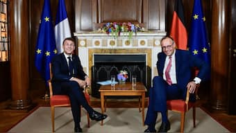 German Chancellor Friedrich Merz and French President Emmanuel Macron hold talks in the library of the Villa Borsig, guesthouse of the German Foreign Ministry, in Berlin. AFP