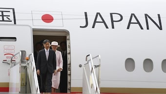Japanese Emperor Naruhito, left and Empress Masako arrive at the Chinggis Khaan International Airport near Ulaanbaatar, Mongolia. AP